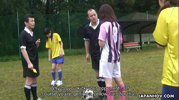 Asian soccer player gets a yellow card and a cock