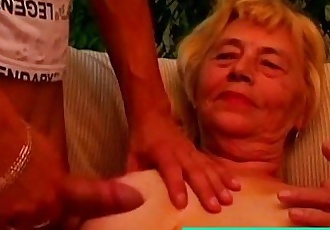 Granny titty fucks her young lover