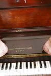 Aged mature woman Lady Sarah playing piano in see thru mesh outfit - part 2